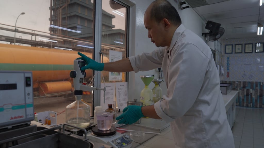 Truckloads of crude palm oil are sent to refineries, where each batch is sampled and sent for laboratory analysis to ensure it meets quality standards before it is refined into the final, manufacturer-ready form of palm oil. Truckloads of crude palm oil are sent to refineries, where each batch is sampled and sent for laboratory analysis to ensure it meets quality standards before it is refined into the final, manufacturer-ready form of palm oil.