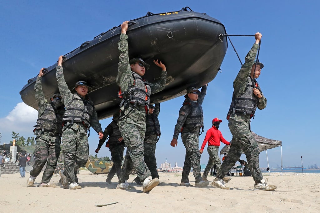 Civilians take part in a marine summer boot camp in South Korea’s North Gyeongsang province last month. Military service is compulsory for able-bodied Korean men. Photo: Yonhap/EPA
