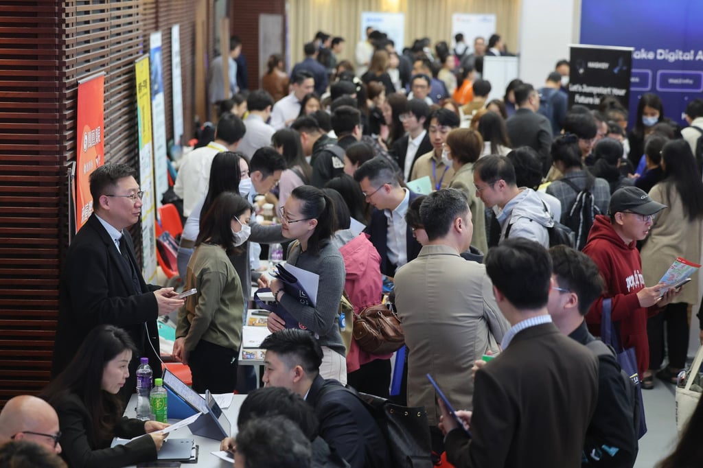 Mainland professionals chat with recruiters at a job expo for top talent pass holders in Tsim Sha Tsui on February 28. Photo: Edmond So Mainland professionals chat with recruiters at a job expo for top talent pass holders in Tsim Sha Tsui on February 28. Photo: Edmond So
