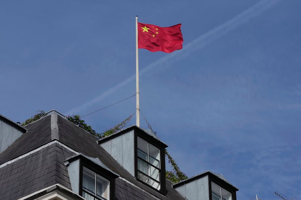 China’s national flag is raised at the current Chinese embassy building in London, England, in 2023. Photo: AP