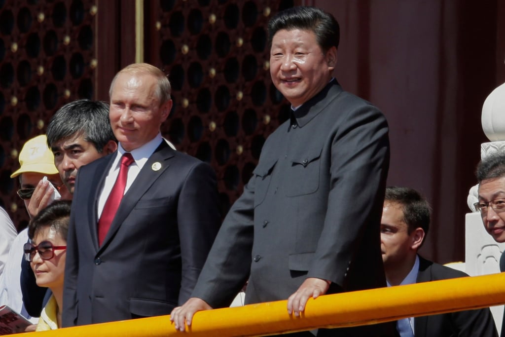 Chinese President Xi Jinping (right) and Russian President Vladimir Putin attending the 2015 military parade in Beijing. Dozens of foreign dignitaries attended, including heads of state. Photo: AP