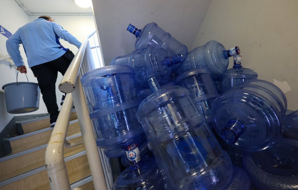 Used water bottles marked “XinLe” at the Hong Kong Squash Centre. Photo: Jelly Tse Used water bottles marked “XinLe” at the Hong Kong Squash Centre. Photo: Jelly Tse