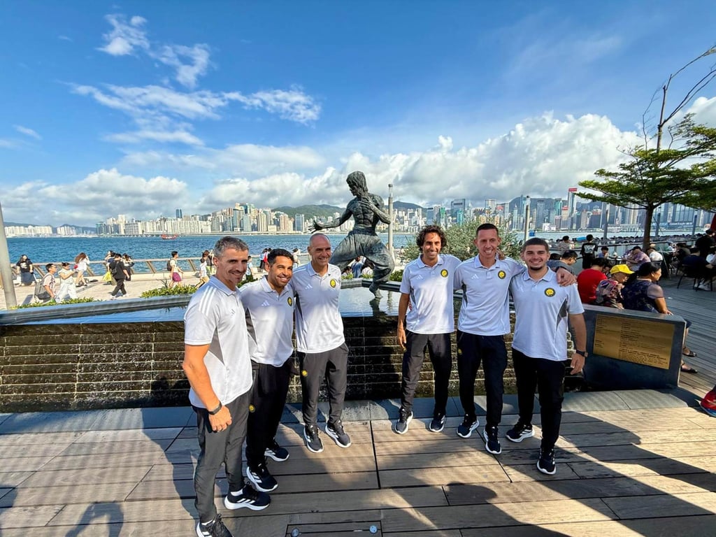 Al-Nassr staff visit the Avenue of Stars, including the Bruce Lee statue. Photo: Mike Chan