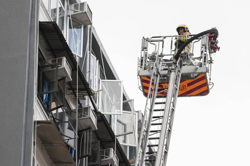 An extendable ladder is used at the scene. Photo: Eugene Lee An extendable ladder is used at the scene. Photo: Eugene Lee