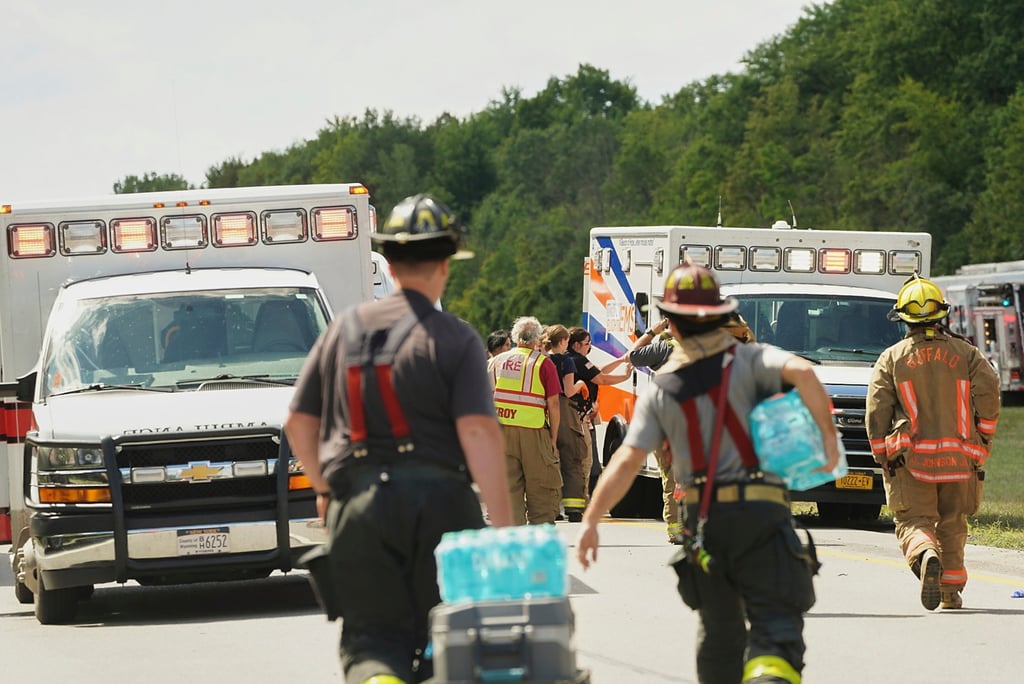 Rescue personnel work the scene of a tour bus crash near Pembroke, New York, on Friday. Photo: Buffalo News via AP
