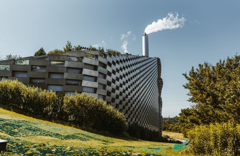 The CopenHill waste-to-energy plant in Copenhagen is topped with an artificial ski slope, which is also used for hiking. Photo: Getty Images The CopenHill waste-to-energy plant in Copenhagen is topped with an artificial ski slope, which is also used for hiking. Photo: Getty Images