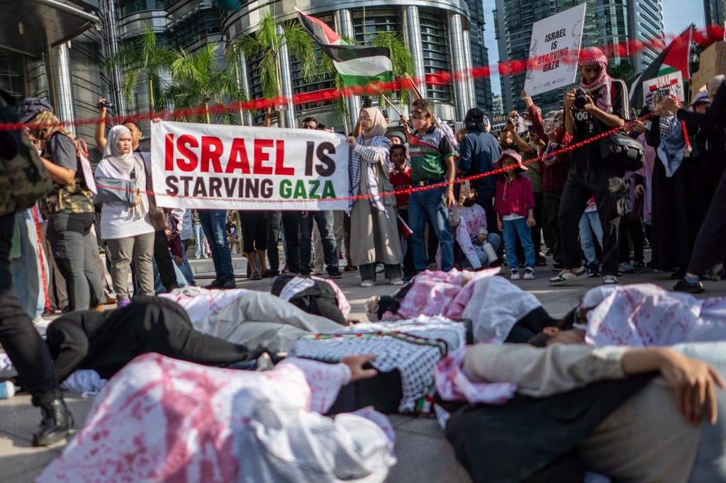 Protesters lay on the ground during a rally for Gaza in Kuala Lumpur earlier this month. Photo: EPA Protesters lay on the ground during a rally for Gaza in Kuala Lumpur earlier this month. Photo: EPA
