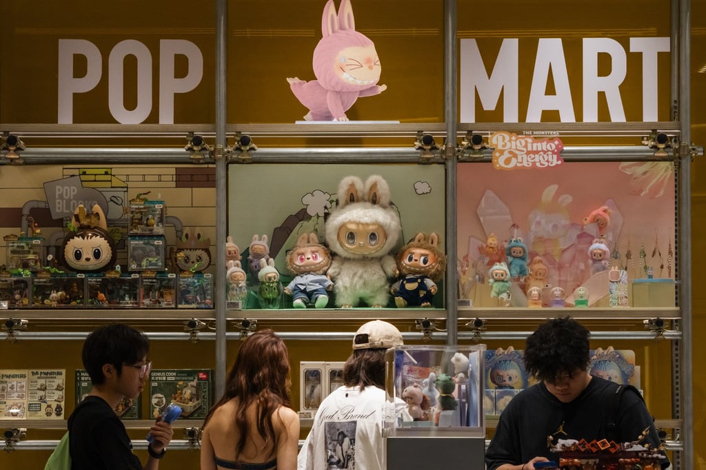 Customers browse a Pop Mart display filled with Labubu characters and collectible figures from The Monsters series in June, in Chongqing, China. Photo: Getty Images