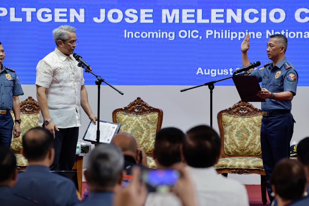Philippine Interior Secretary Juanito Remulla (left) administers the oath to incoming police officer-in-charge Lieutenant General Jose Nartatez during a change-of-command ceremony at Camp Crame in Quezon City on Tuesday. Photo: EPA Philippine Interior Secretary Juanito Remulla (left) administers the oath to incoming police officer-in-charge Lieutenant General Jose Nartatez during a change-of-command ceremony at Camp Crame in Quezon City on Tuesday. Photo: EPA