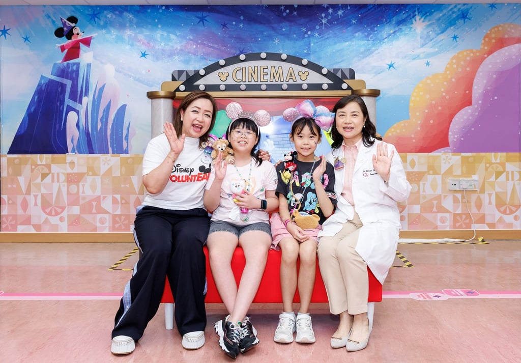 From left: Anita Lai, Hong Kong Disneyland’s vice-president of communications and public affairs, child patients Tsz-huen and An-yu, and Dr Rever Li Chak-ho, deputy hospital chief executive of Tuen Mun Hospital, enjoy the party at the Paediatrics and Adolescent Medicine Specialist Out-patient Clinic. From left: Anita Lai, Hong Kong Disneyland’s vice-president of communications and public affairs, child patients Tsz-huen and An-yu, and Dr Rever Li Chak-ho, deputy hospital chief executive of Tuen Mun Hospital, enjoy the party at the Paediatrics and Adolescent Medicine Specialist Out-patient Clinic.