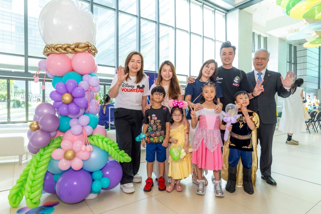 Anita Lai (left) and Dr Lee Tsz-leung (far right), hospital chief executive of Hong Kong Children’s Hospital, with child patients dressed as Disney princes and princesses, and parents during the party at the hospital. Anita Lai (left) and Dr Lee Tsz-leung (far right), hospital chief executive of Hong Kong Children’s Hospital, with child patients dressed as Disney princes and princesses, and parents during the party at the hospital.