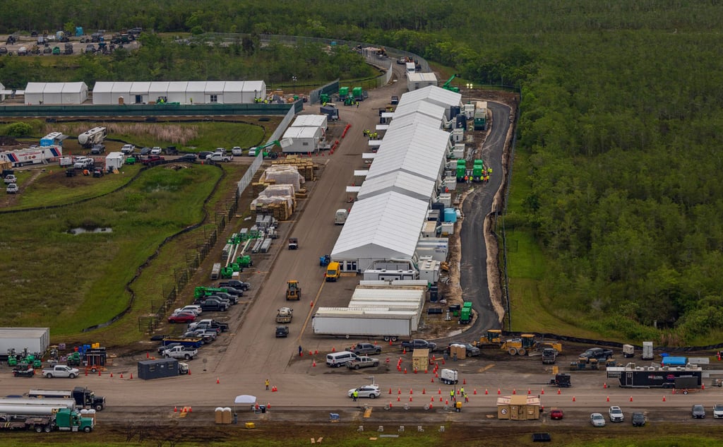 Structures, including gigantic tents, are seen from the air at the migrant detention centre in Ochopee, Florida, in July. Photo: Miami Herald via TNS Structures, including gigantic tents, are seen from the air at the migrant detention centre in Ochopee, Florida, in July. Photo: Miami Herald via TNS