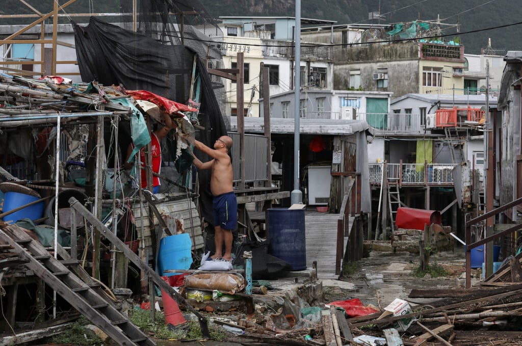 Tai O village residents clean up after flooding caused by Typhoon Mangkhut. Tai O village residents clean up after flooding caused by Typhoon Mangkhut.