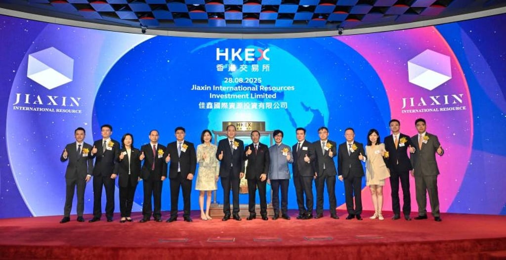 HKEX chairman Carlson Tong (centre), CEO Bonnie Chan (sixth left), Hong Kong’s Belt and Road Initiative Commissioner Nicolas Ho (seventh right) and executives of Jiaxin International Resources Investment at the company’s trading debut in Hong Kong on Thursday. Photo: Handout