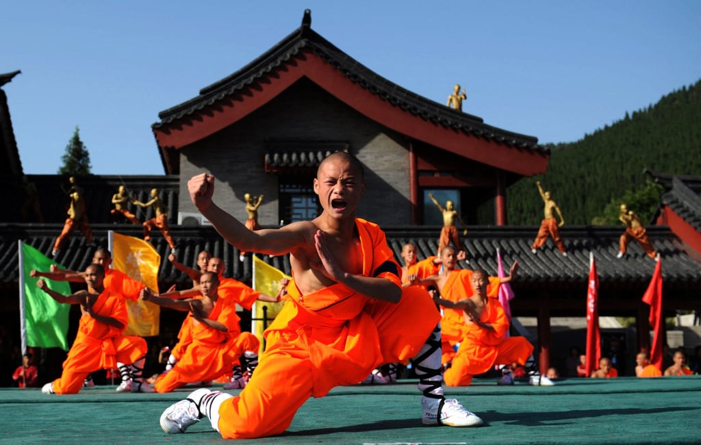 Shaolin students perform at a Shaolin Temple to welcome guests during the 9th Zhengzhou International Shaolin Wushu Festival in Zhengzhou, China, in 2012. Photo: AFP Shaolin students perform at a Shaolin Temple to welcome guests during the 9th Zhengzhou International Shaolin Wushu Festival in Zhengzhou, China, in 2012. Photo: AFP