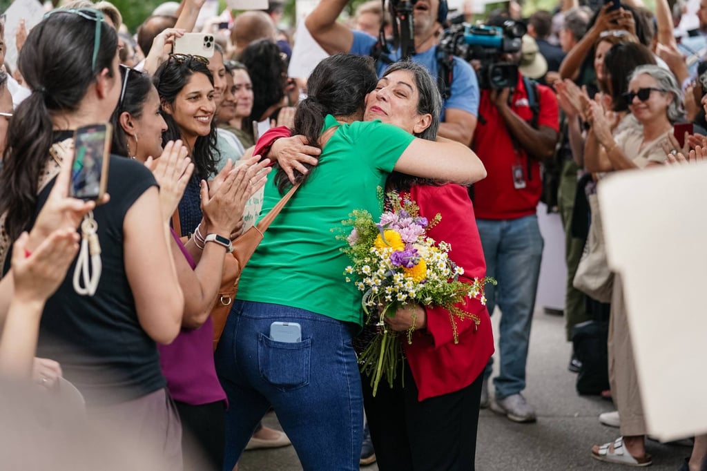 Former CDC official Deb Houry gets a hug as CDC staff and supporters line up outside the agency’s global headquarters on Wednesday to honour her and two other leaders who resigned in the wake of Susan Monarez being fired. Photo: AFP Former CDC official Deb Houry gets a hug as CDC staff and supporters line up outside the agency’s global headquarters on Wednesday to honour her and two other leaders who resigned in the wake of Susan Monarez being fired. Photo: AFP