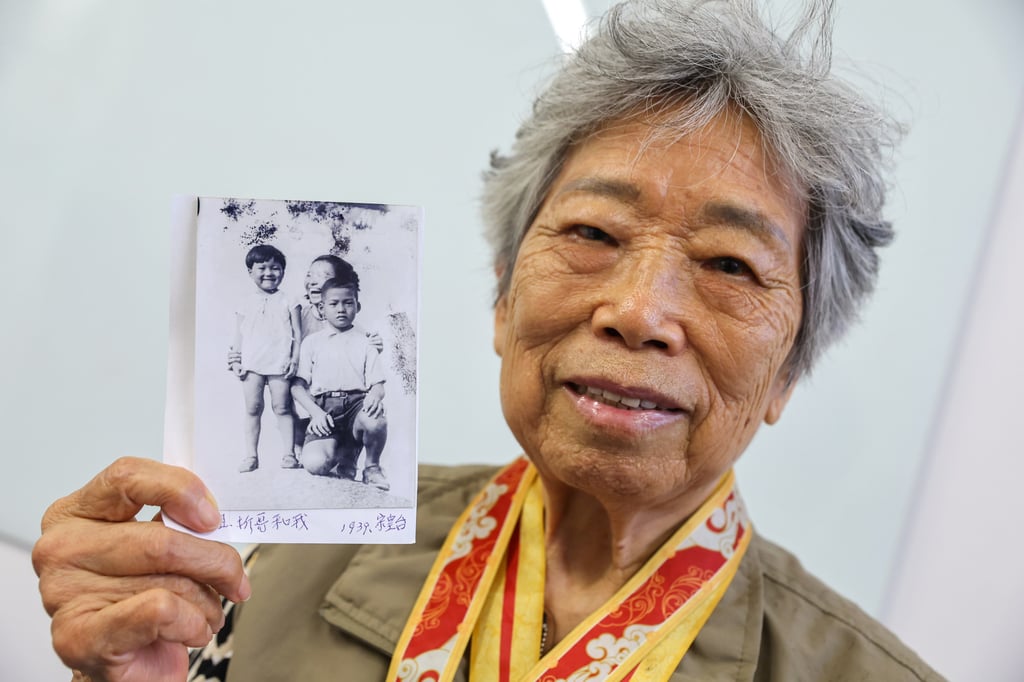 Lam Chun, with a family picture, says that if people did not resist, they would be killed. Photo: Edmond So