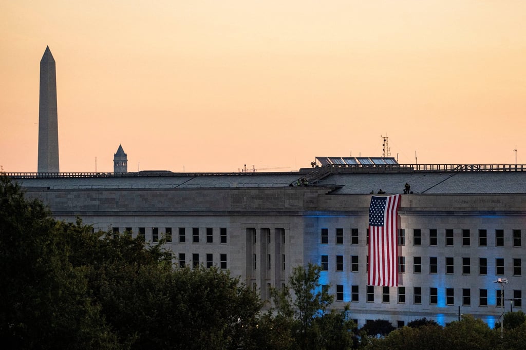 An American flag is unfurled from the roof of the Pentagon. A Pentagon spokeswoman last month said a security forum promoted “the evil of globalism, disdain for our great country and hatred” for the US president. Photo: Reuters An American flag is unfurled from the roof of the Pentagon. A Pentagon spokeswoman last month said a security forum promoted “the evil of globalism, disdain for our great country and hatred” for the US president. Photo: Reuters