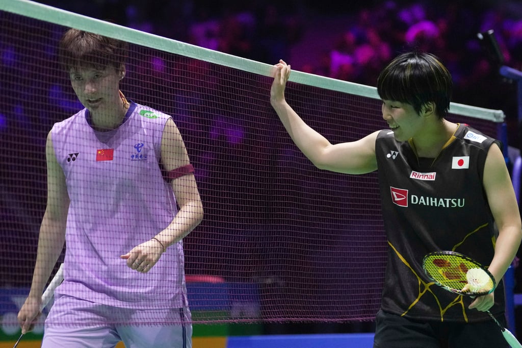 Akane Yamaguchi (right) and Chen Yufei at the end of their final in Paris on Sunday. Photo: AP