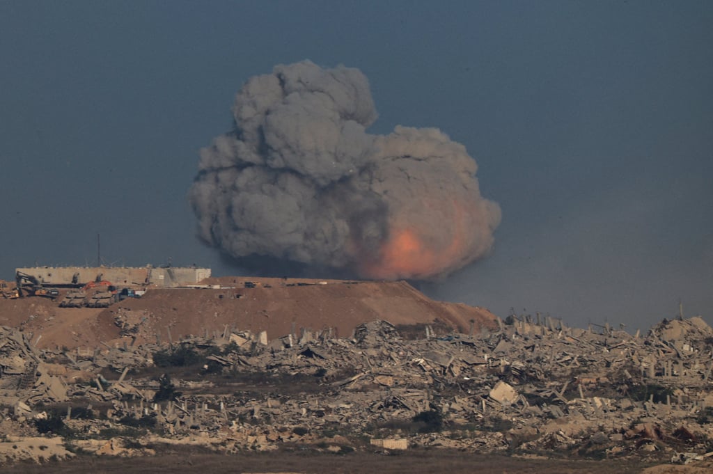 Smoke rises from Gaza after an explosion. Photo: Reuters Smoke rises from Gaza after an explosion. Photo: Reuters