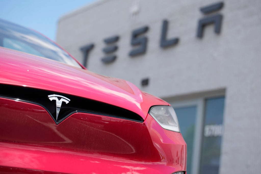 An unsold Model X sports utility vehicle sits outside a Tesla showroom in Littleton, Colorado. Photo: AP An unsold Model X sports utility vehicle sits outside a Tesla showroom in Littleton, Colorado. Photo: AP
