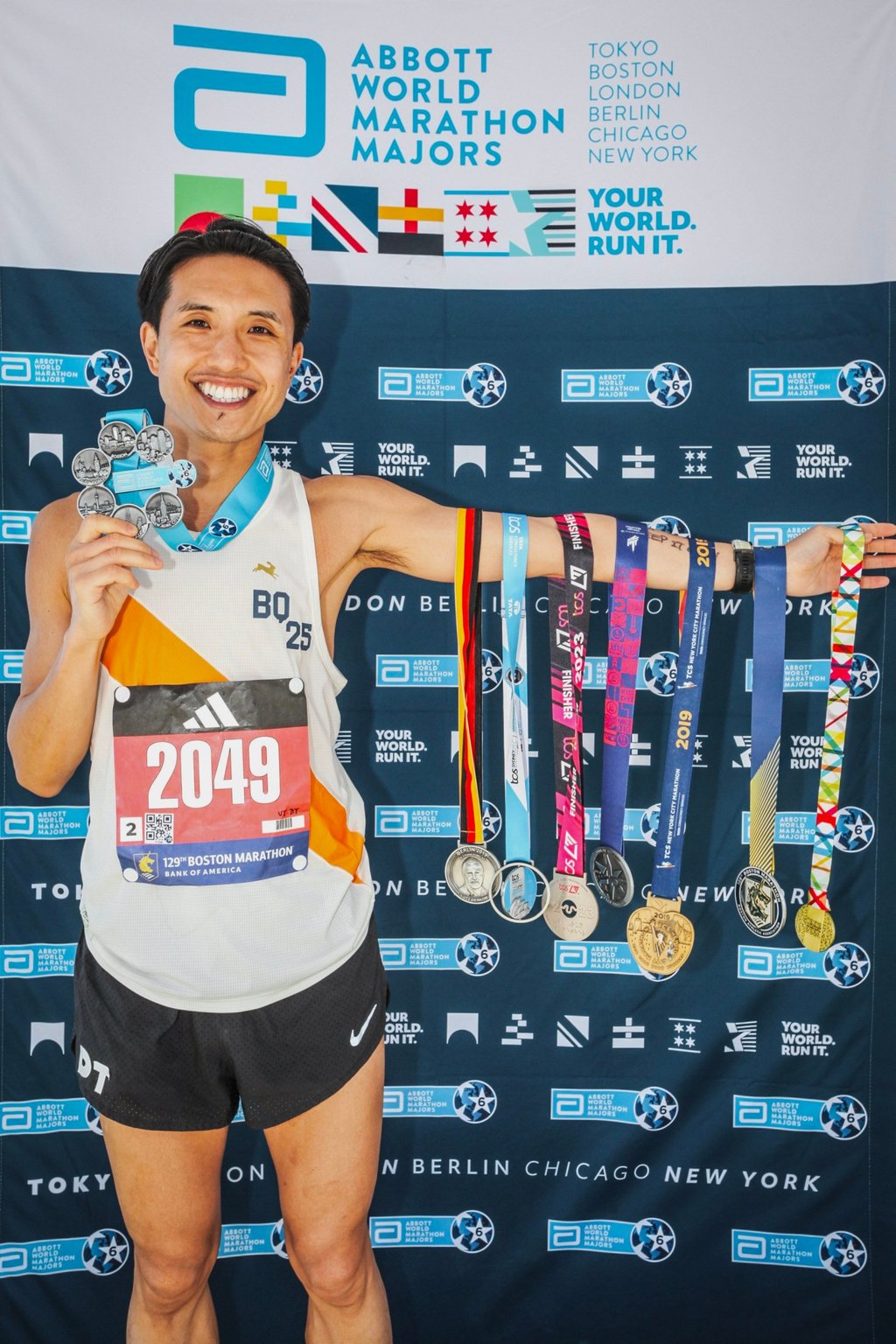 Lui holds his seven Marathon Majors medals. Photo: courtesy of Dennis Lui Lui holds his seven Marathon Majors medals. Photo: courtesy of Dennis Lui