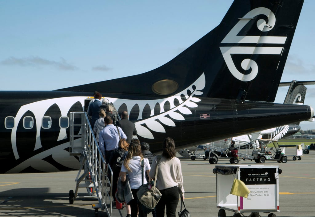 Passengers board an Air New Zealand flight at Christchurch Airport. Photo: AP Passengers board an Air New Zealand flight at Christchurch Airport. Photo: AP