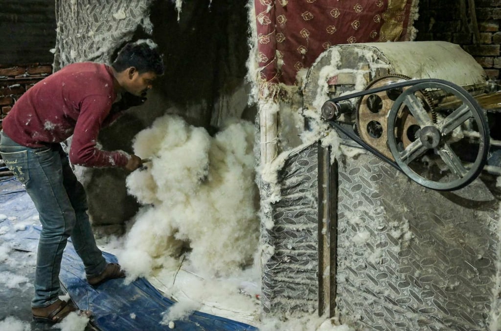 A worker sorts cotton at a processing facility in Amritsar, India, on August 25. Indian exporters are scrambling for options to mitigate the tariff fallout as it threatens to upend low-margin, labour-intensive industries ranging from gems and jewellery to textiles and seafood. Photo: AFP A worker sorts cotton at a processing facility in Amritsar, India, on August 25. Indian exporters are scrambling for options to mitigate the tariff fallout as it threatens to upend low-margin, labour-intensive industries ranging from gems and jewellery to textiles and seafood. Photo: AFP