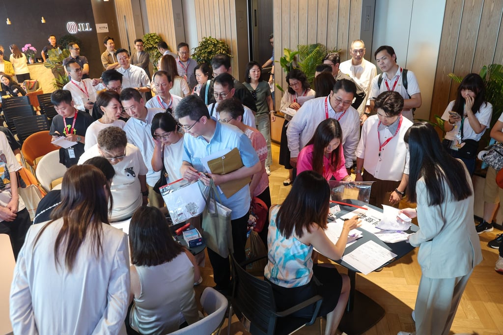 Potential buyers and estate agents at the sales office of 33 Kennedy Road, the 71-unit completed project in Wan Chai jointly developed by The Development Studio and Fu Hop Investment, on August 10. Photo: Edmond So Potential buyers and estate agents at the sales office of 33 Kennedy Road, the 71-unit completed project in Wan Chai jointly developed by The Development Studio and Fu Hop Investment, on August 10. Photo: Edmond So