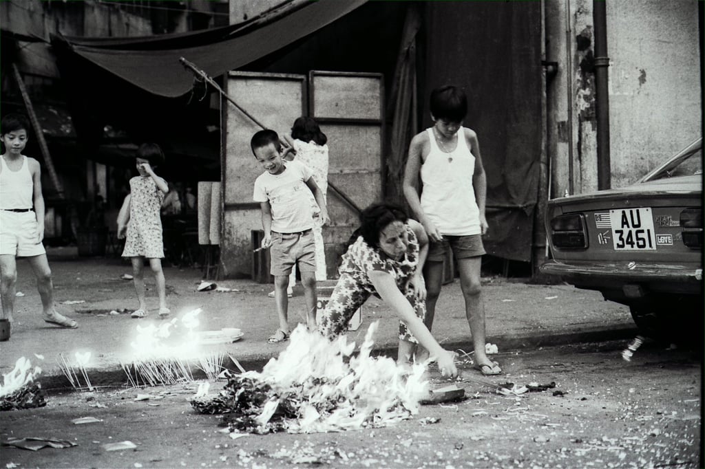 Worshippers burn offerings on a street to appease the spirits during the Hungry Ghost Festival in 1972. Photo: SCMP Archives