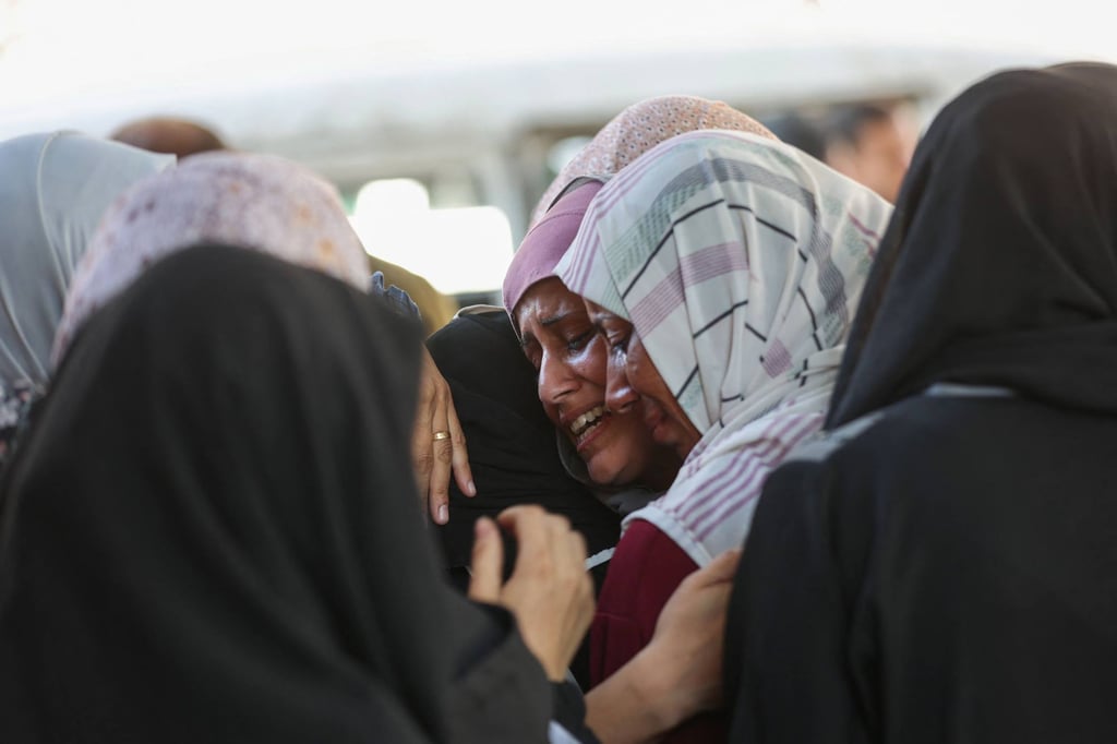 Palestinian women mourn the death of loved ones outside a hospital in Gaza City on Tuesday. Photo: AFP Palestinian women mourn the death of loved ones outside a hospital in Gaza City on Tuesday. Photo: AFP
