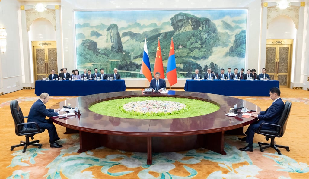 Chinese President Xi Jinping (centre) hosts his Russian and Mongolian counterparts during a trilateral meeting at the Great Hall of the People in Beijing on Tuesday. Photo: Xinhua