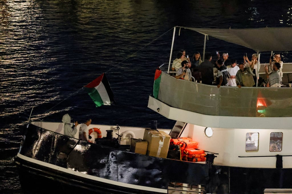 A vessel departs Barcelona after stormy weather forced the flotilla to return to port earlier. Photo: Reuters A vessel departs Barcelona after stormy weather forced the flotilla to return to port earlier. Photo: Reuters