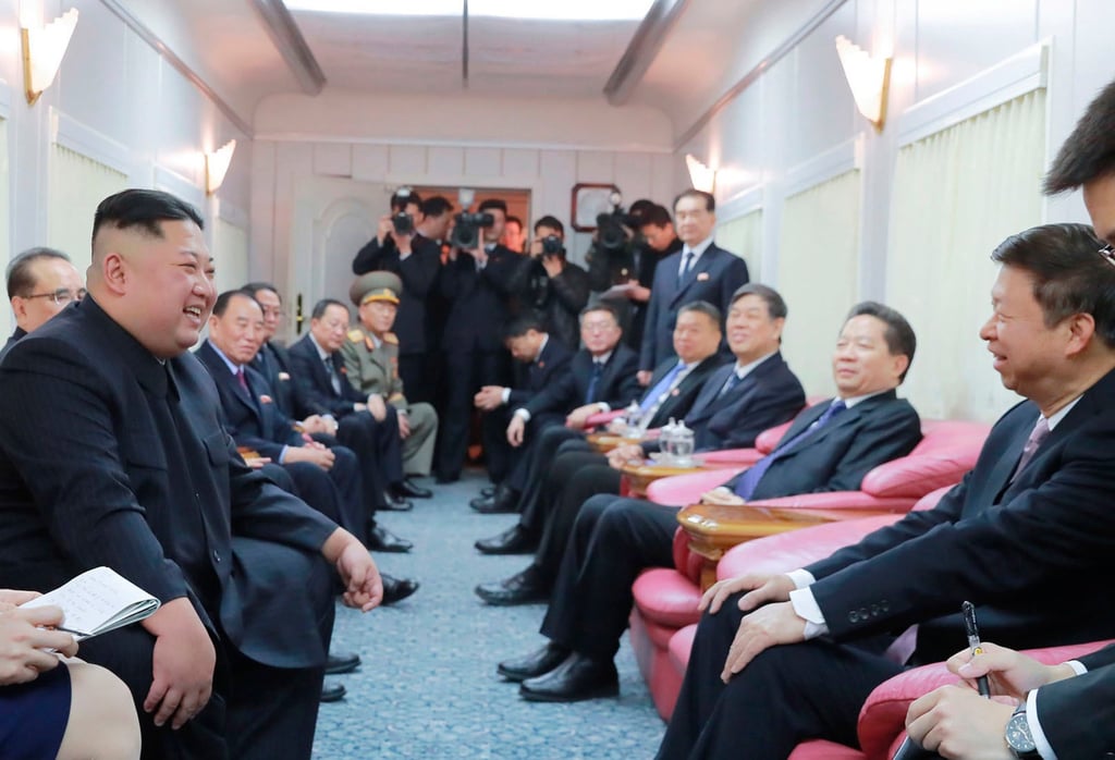Kim Jong-un (left) talks to Chinese officials in a train on the way home from China on January 19, 2019. Photo: KCNA/AP Kim Jong-un (left) talks to Chinese officials in a train on the way home from China on January 19, 2019. Photo: KCNA/AP