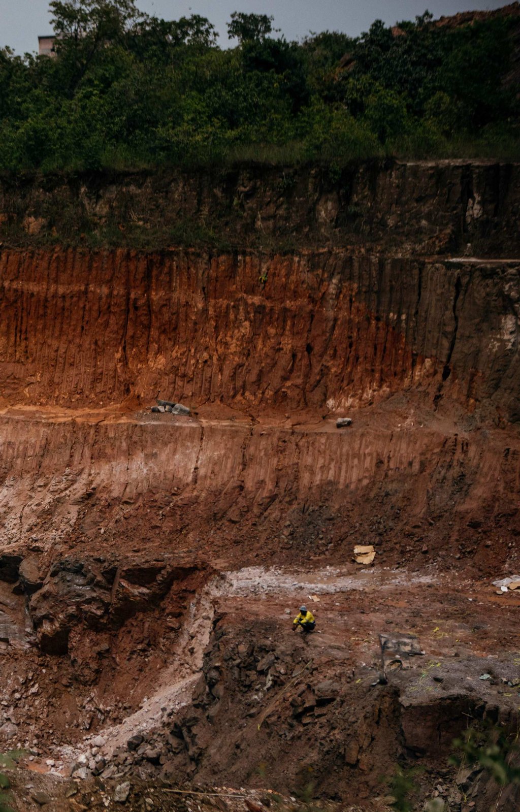 A Zambian miner rests in a private open pit mine in Kitwe on March 2. Photo: AFP