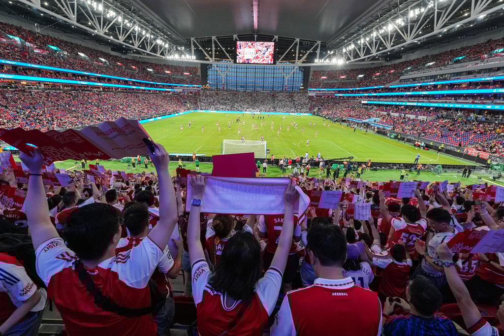 Fans watching a friendly between Arsenal and Tottenham Hotspur at Kai Tak Stadium. Photo: Elson Li Fans watching a friendly between Arsenal and Tottenham Hotspur at Kai Tak Stadium. Photo: Elson Li