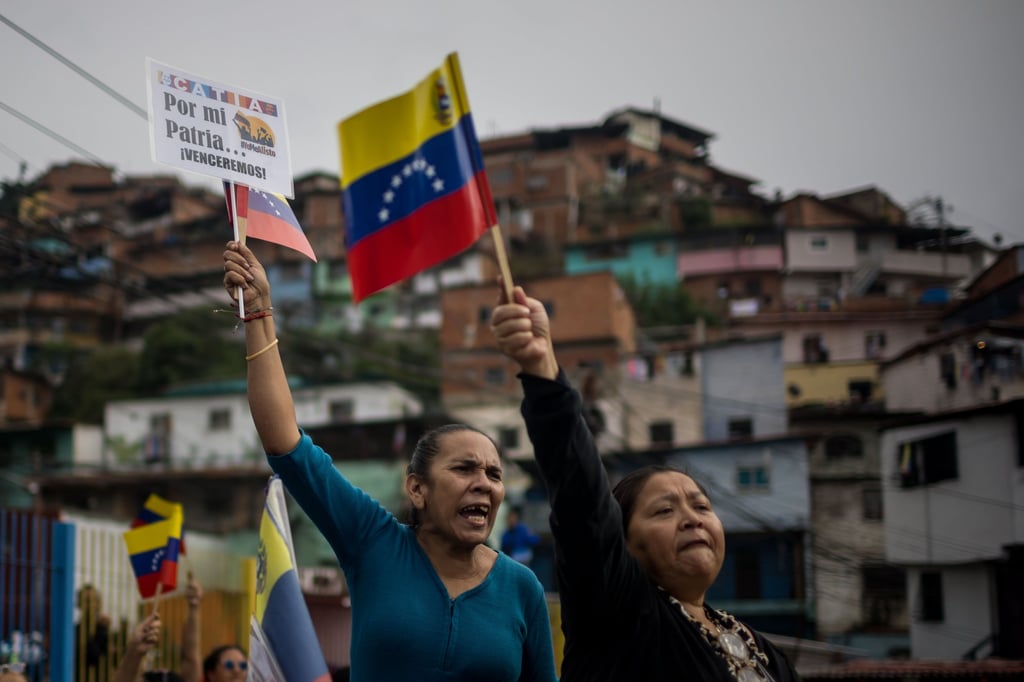 Protesters in Caracas, Venezuela, on Friday show their support for President Nicolas Maduro in the face of what they consider “threats” from the US. Photo: EPA