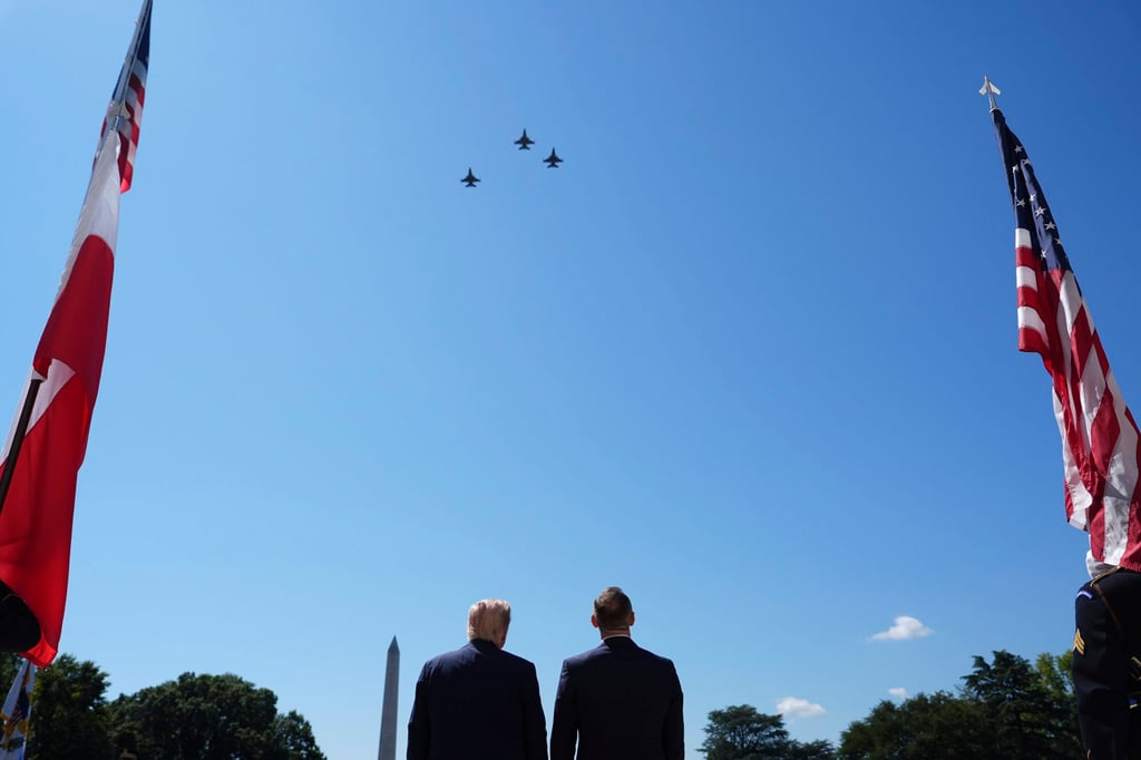 US President Donald Trump and Polish President Karol Nawrocki watch a military aircraft flyover at the White House. Photo: AP