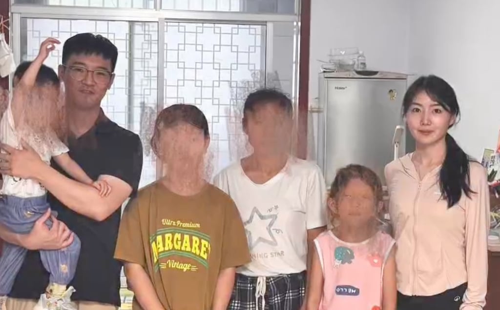 The couple photographed with the children who will benefit from their generosity. Photo: Handout