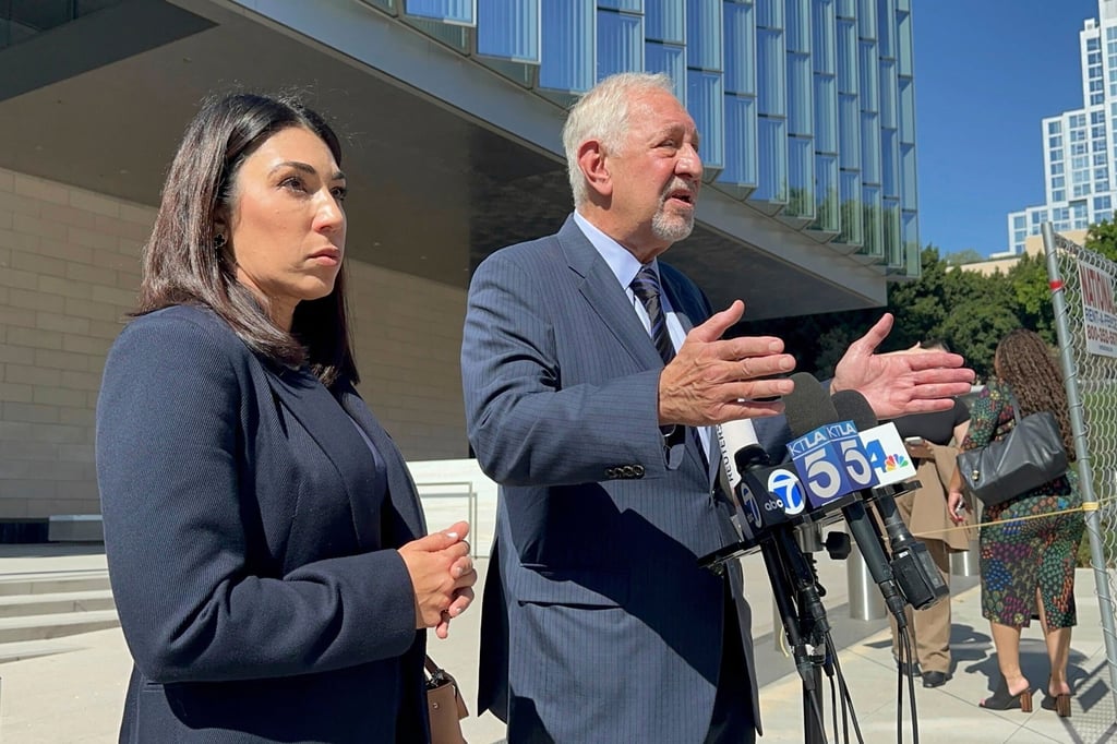 Lawyers Alexandra Kazarian and Mark Geragos address reporters outside the court. Photo: AP Lawyers Alexandra Kazarian and Mark Geragos address reporters outside the court. Photo: AP