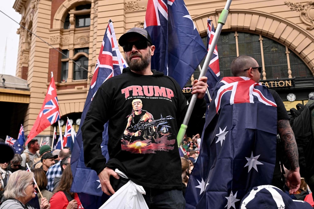 A protester wearing a shirt showing an image of US President Donald Trump as a stylised depiction of Rambo during the “March for Australia” anti-immigration rally in Melbourne on August 31. Photo: AFP A protester wearing a shirt showing an image of US President Donald Trump as a stylised depiction of Rambo during the “March for Australia” anti-immigration rally in Melbourne on August 31. Photo: AFP