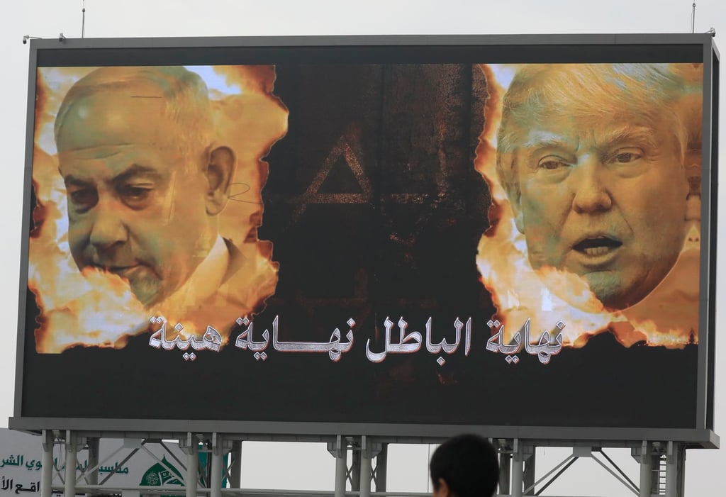 A digital sign featuring images of Israeli Prime Minister Benjamin Netanyahu and US President Donald Trump is seen at a pro-Palestinian rally in Sana’a, Yemen, on August 22. Photo: EPA