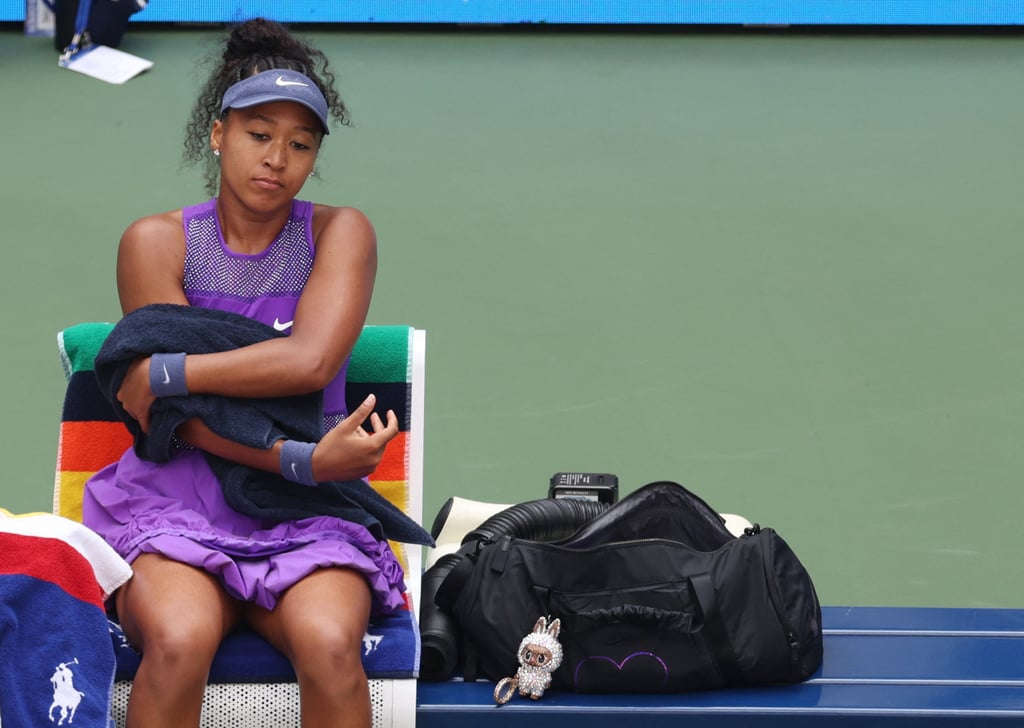Naomi Osaka during her round of 16 match with the “Althea Glitterson” Labubu doll. Photo: Reuters
