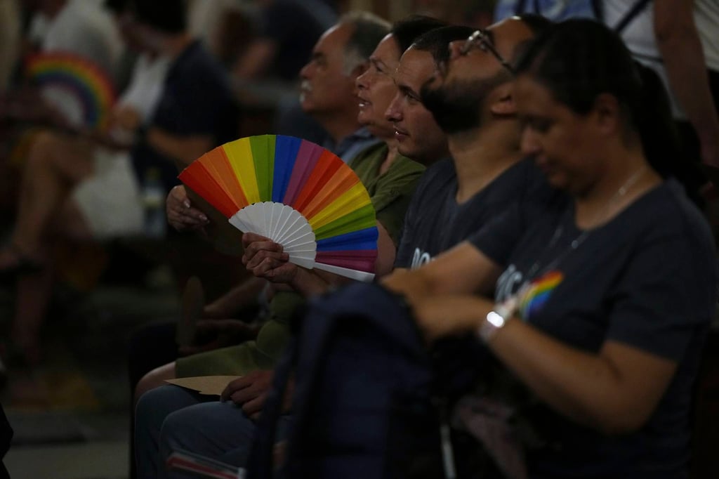 Members of the LGBTQ community attend a vigil prayer in the Church of the Gesu in central Rome on Friday. Photo: AP Members of the LGBTQ community attend a vigil prayer in the Church of the Gesu in central Rome on Friday. Photo: AP