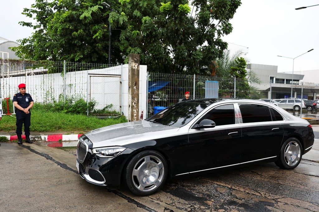 A car in the motorcade believed to be carrying Thailand’s former prime minister Thaksin Shinawatra drives by after leaving a private jet terminal at Bangkok’s Don Mueang International Airport on Monday. Photo: Reuters