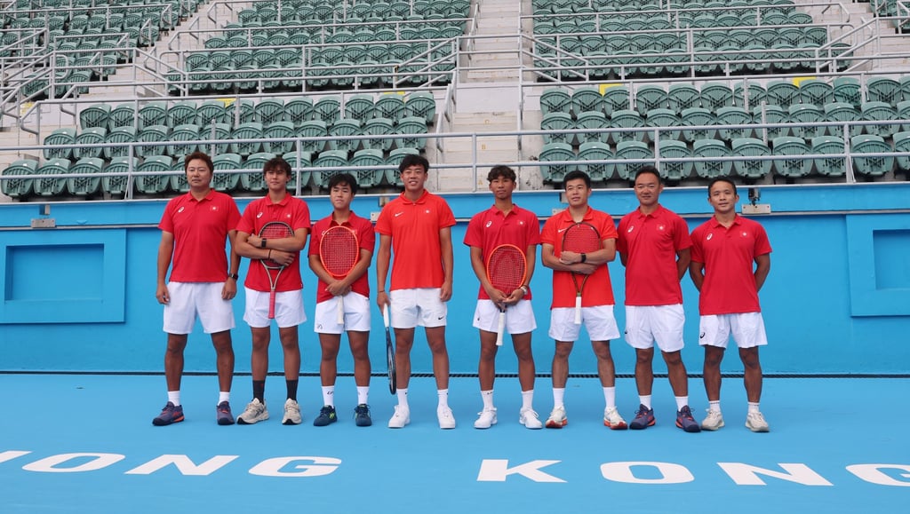 Hong Kong players (from second left) Kai Thompson, Nicholas Cheng, Coleman Wong, Wong Tsz-fu and Wong Chun-hun with team coaches at the Victoria Park Tennis Court on Monday. Photo: Edmond So