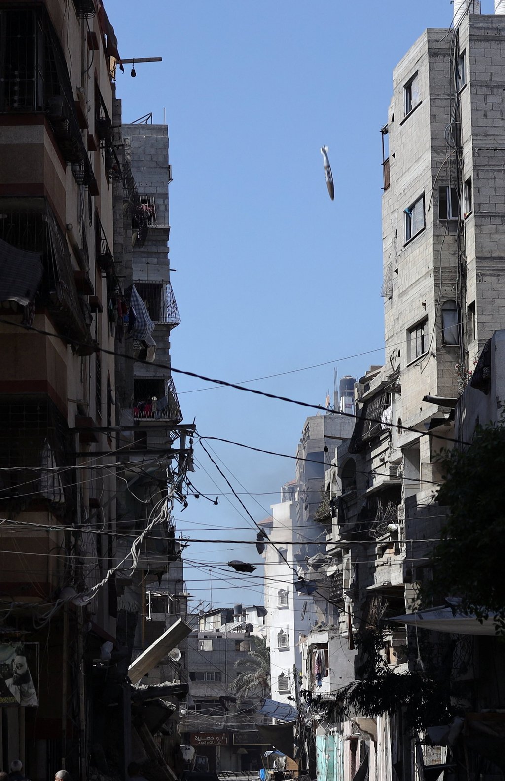 A missile falls towards a house during an Israeli air strike in Gaza City on Sunday. Photo: Sunday A missile falls towards a house during an Israeli air strike in Gaza City on Sunday. Photo: Sunday