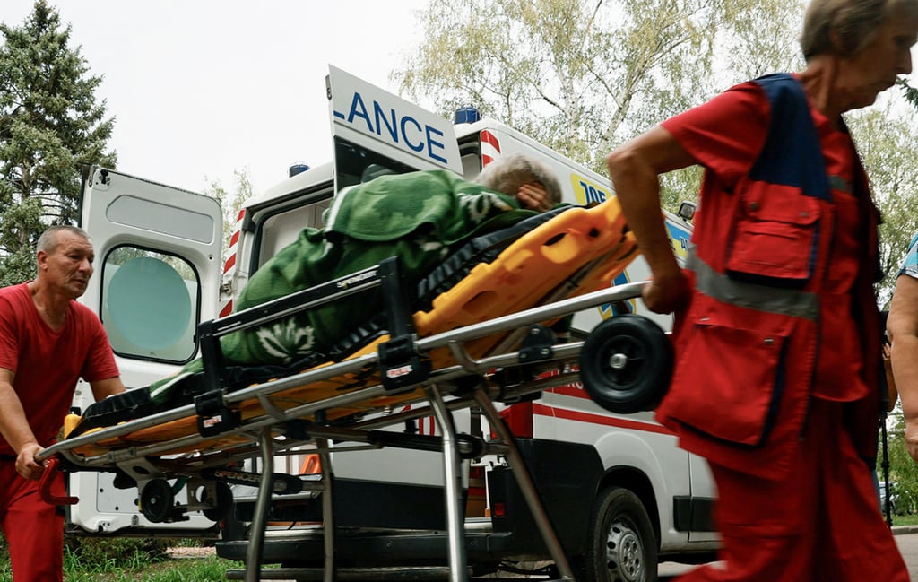 Medical staff deliver a resident of Yarova who was wounded following a Russian aerial strike to a hospital in an undisclosed location on Tuesday. Photo: First Center of the Information and Communication support of the Land Forces of Ukraine/AFP