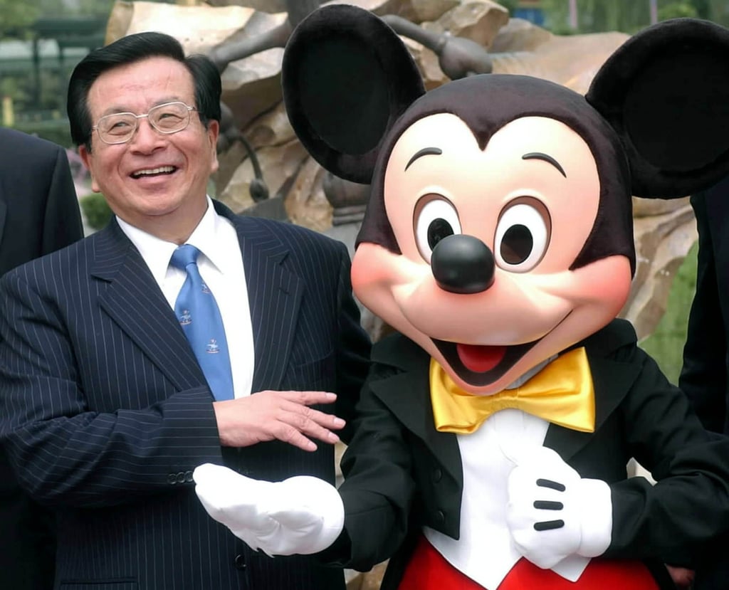 Chinese Vice-President Zeng Qinghong poses with Mickey Mouse at the grand opening ceremony of Hong Kong Disneyland. File photo: Xinhua via AP Chinese Vice-President Zeng Qinghong poses with Mickey Mouse at the grand opening ceremony of Hong Kong Disneyland. File photo: Xinhua via AP