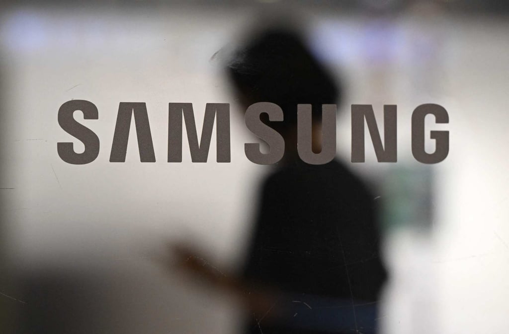 A woman walks past a logo of Samsung Electronics displayed on a glass door at the company’s Seocho building in Seoul on July 8, 2025. Photo: AFP A woman walks past a logo of Samsung Electronics displayed on a glass door at the company’s Seocho building in Seoul on July 8, 2025. Photo: AFP